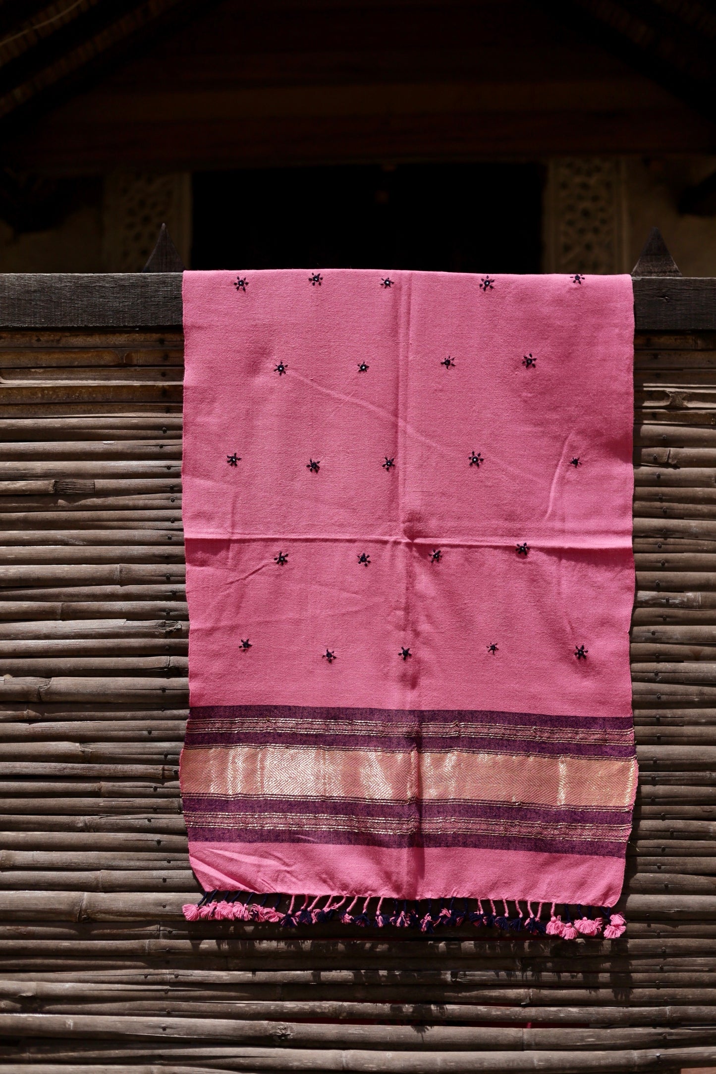 Classic handwoven woolen stole in rose blush designed for warmth, comfort, and sophisticated styling