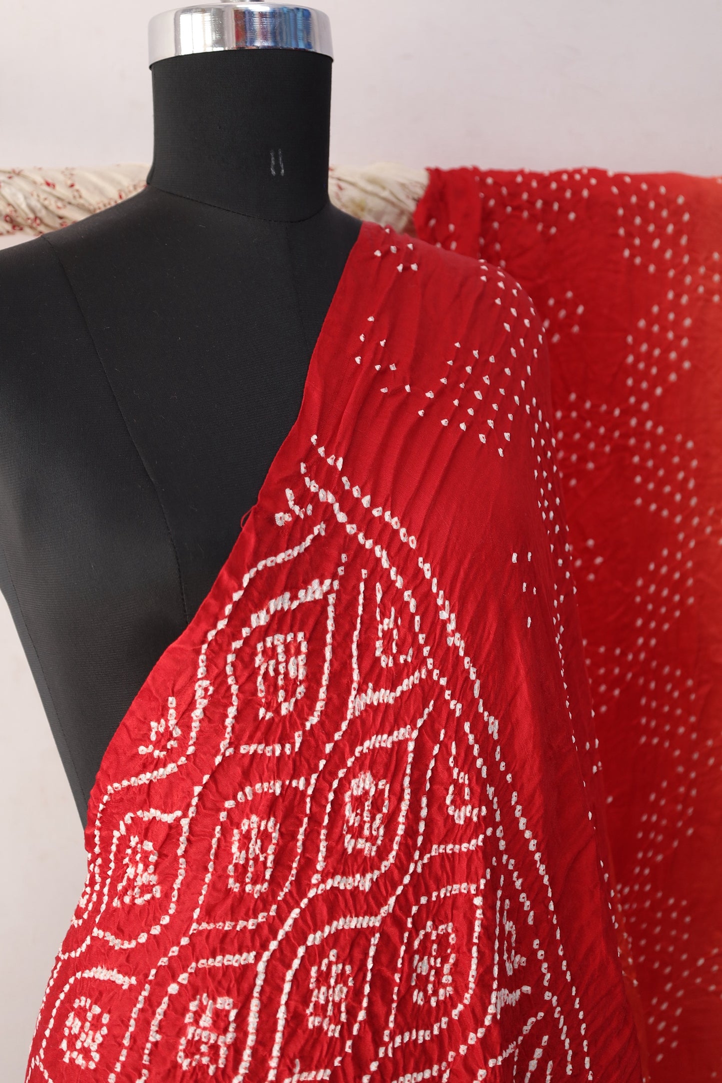 Scarlet Bandhani Gajji silk saree featuring intricate tie-dye patterns and an elegant zari pallu