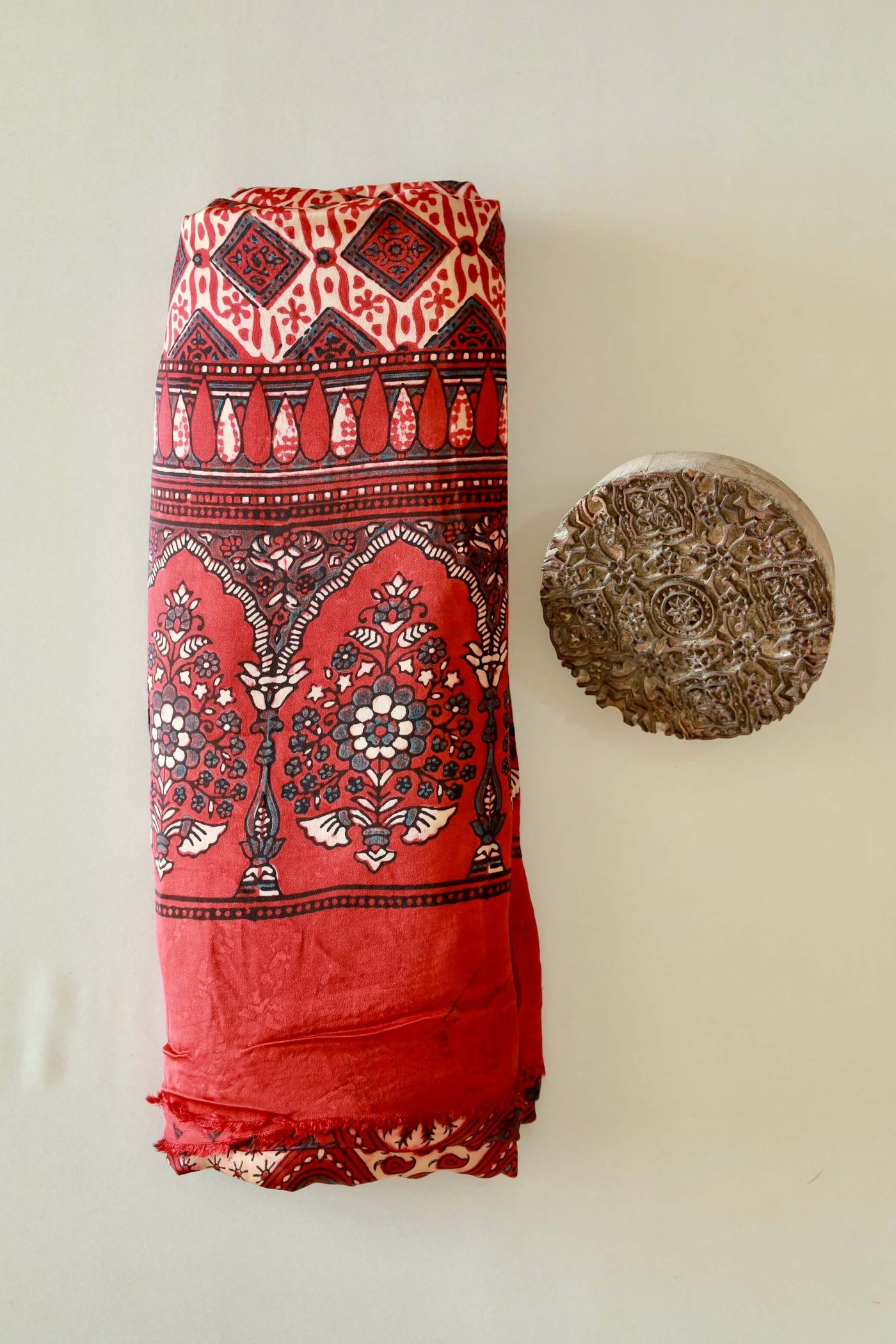 Premium scarlet red modal silk Ajrakh saree with rich heritage-inspired designs and fluid fall
