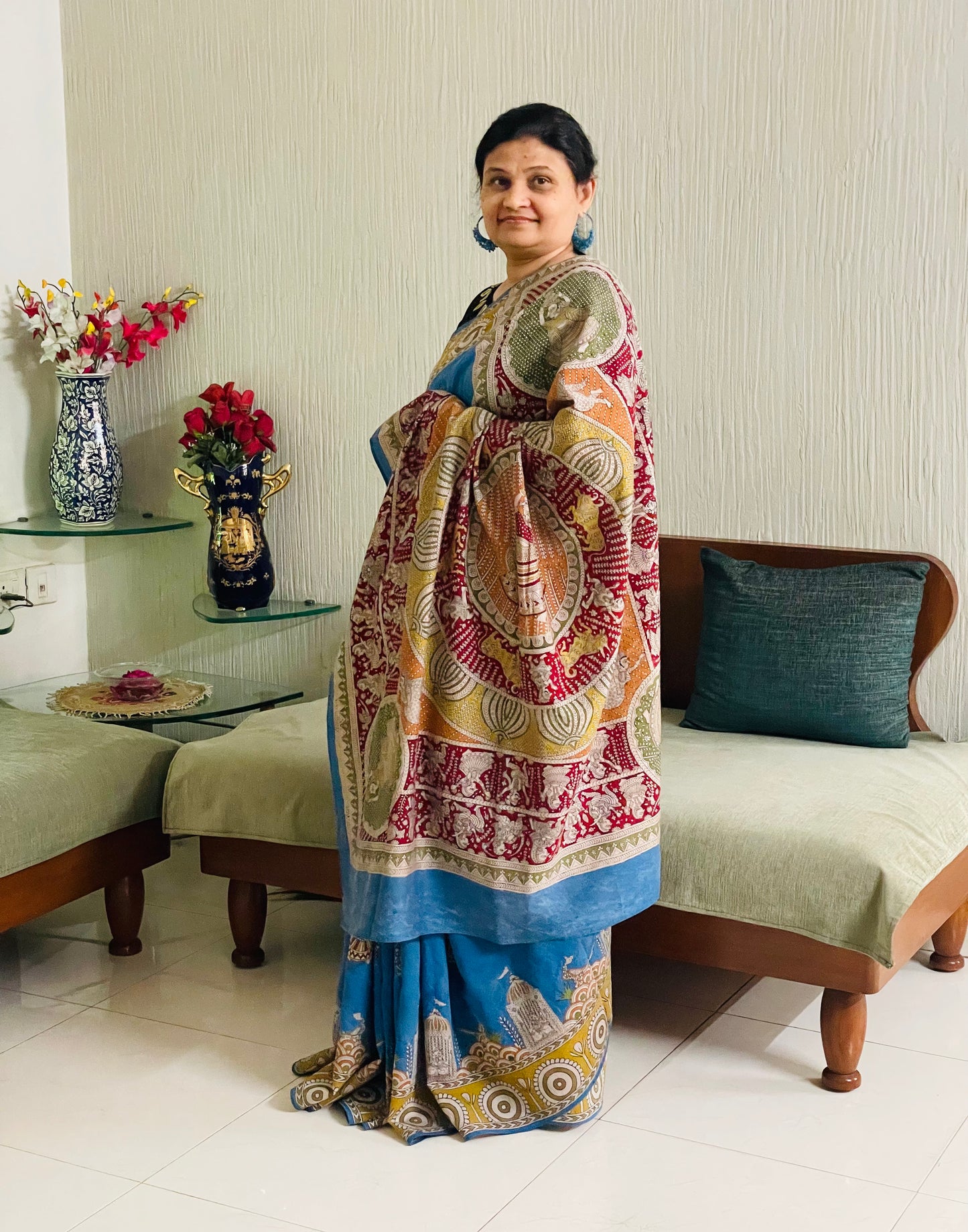 Elegant sky gold saree showcasing detailed Mata Ni Pachedi artwork created by skilled artisans