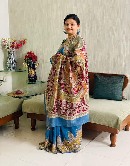 Elegant sky gold saree showcasing detailed Mata Ni Pachedi artwork created by skilled artisans