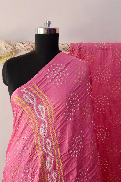 Soft pink Bandhani Gajji silk saree featuring intricate tie-dye patterns and an elegant zari pallu