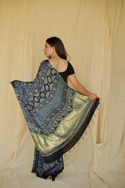 Sophisticated steel blue Ajrakh saree in modal silk showcasing skilled artisan block printing
