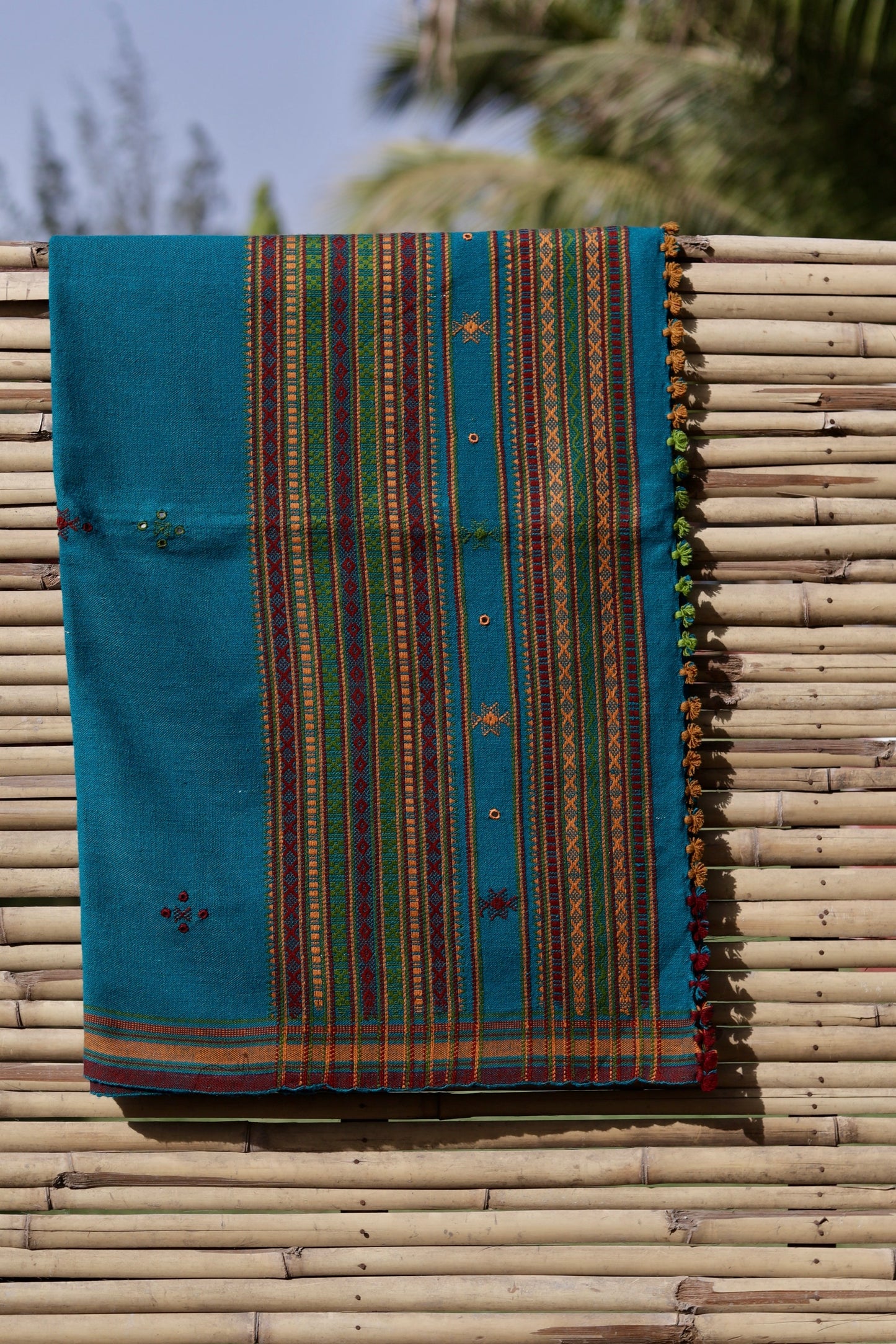 Traditional turquoise blue wool shawl showcasing authentic weaving artistry and timeless appeal