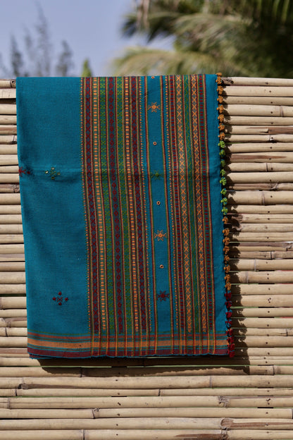 Traditional turquoise blue wool shawl showcasing authentic weaving artistry and timeless appeal