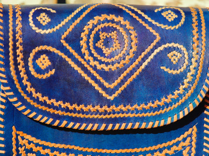 Elegant leather bag with embroidered accents and durable leather construction

