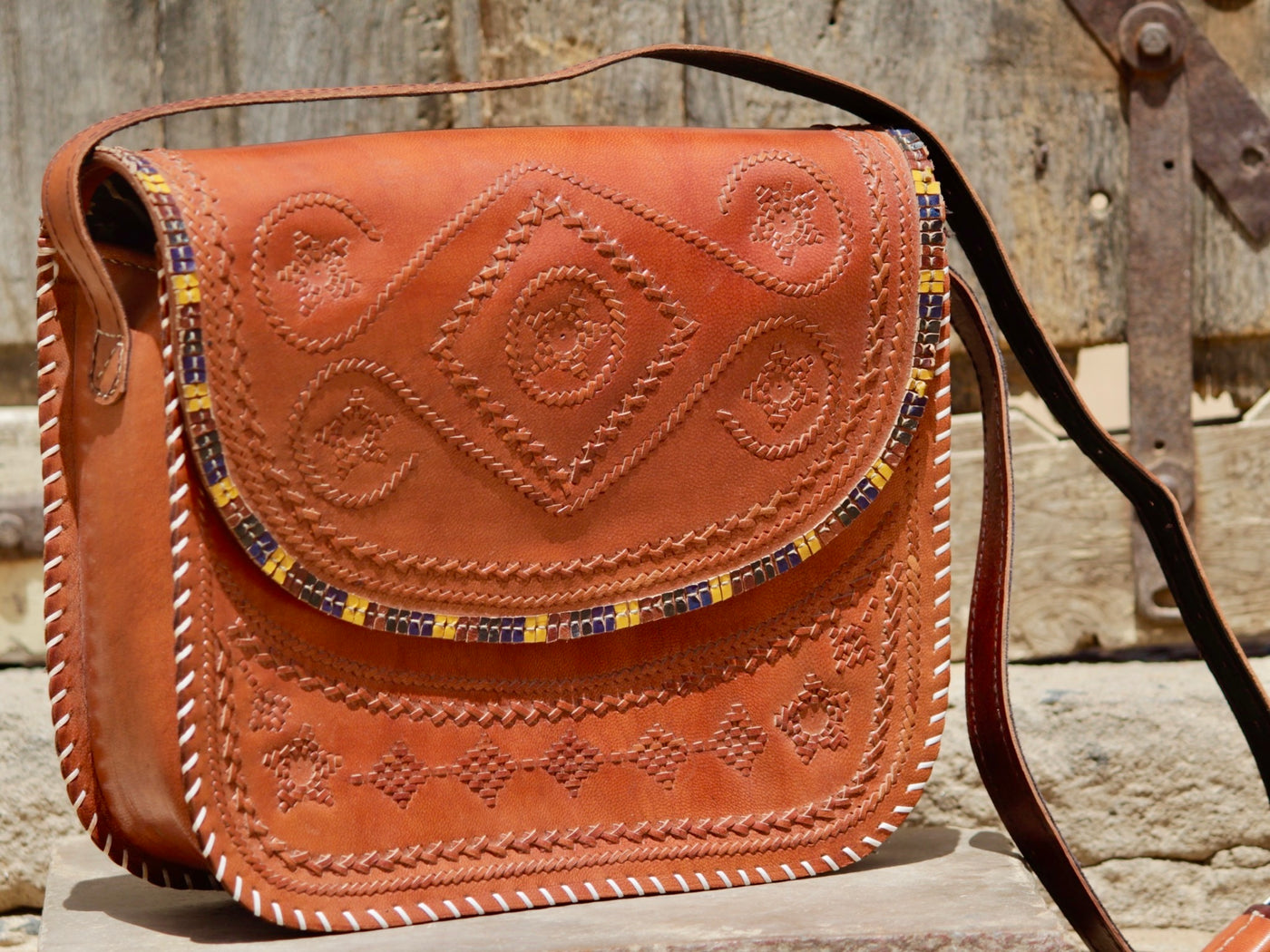 Artisan-crafted leather bag featuring traditional hand stitching and durable construction