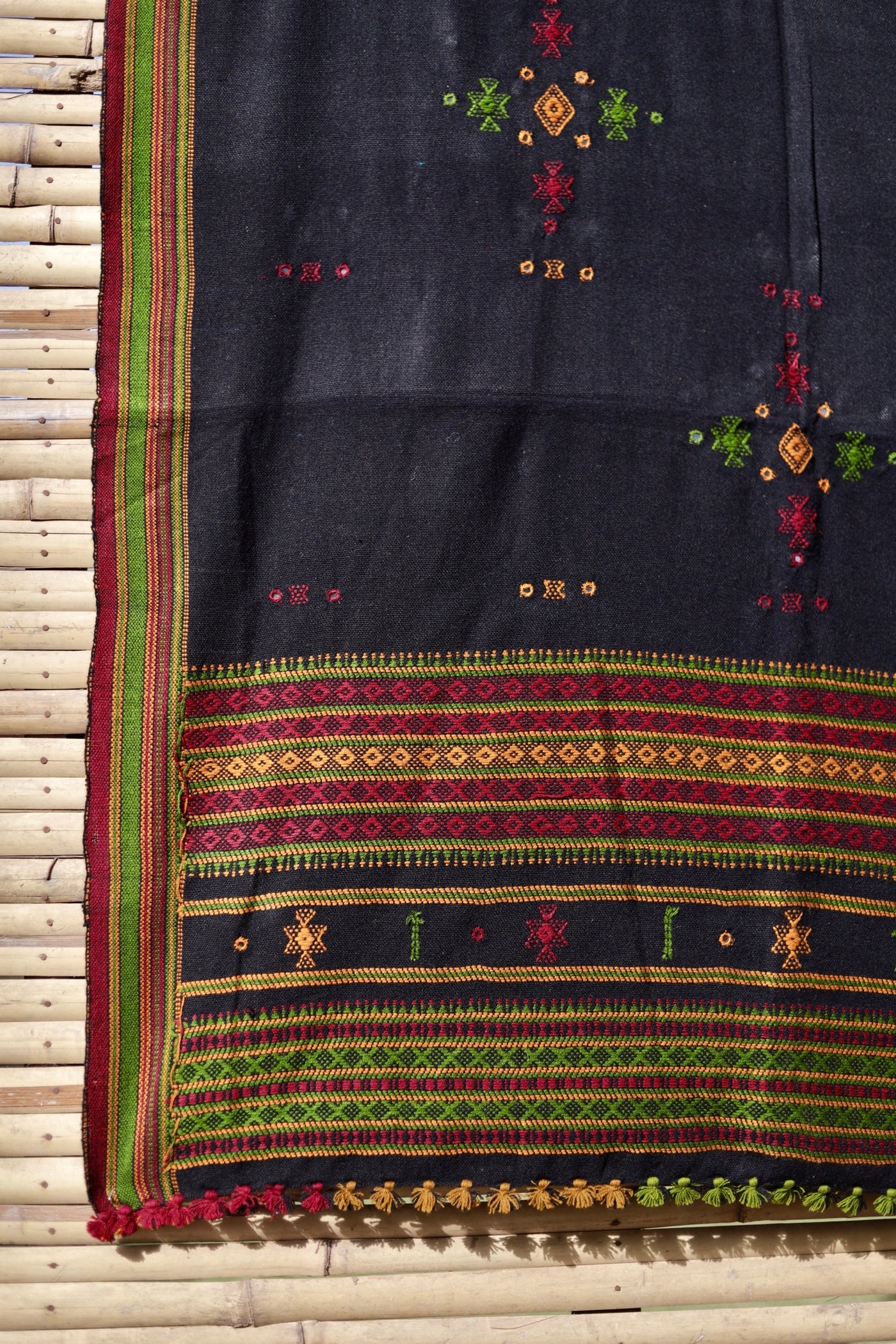 Forest black handwoven woolen shawl featuring a deep earthy tone and skilled artisan craftsmanship