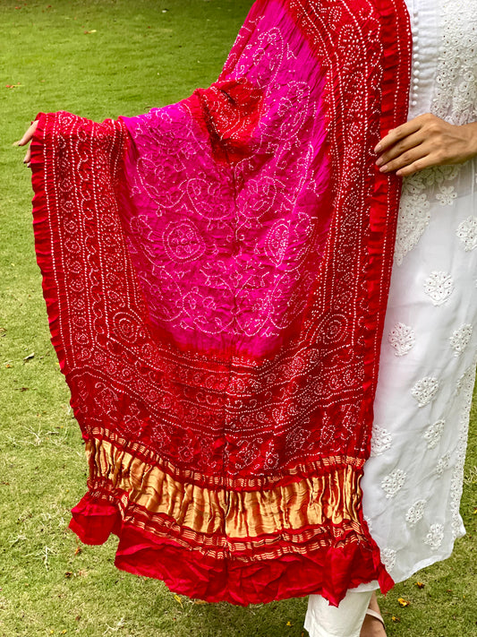 Fuchsia pink Bandhani Gajji silk dupatta featuring traditional tie-dye craftsmanship and elegant drape