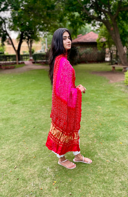 Traditional fuchsia pink Bandhani Gajji silk dupatta with intricate artisanal patterns