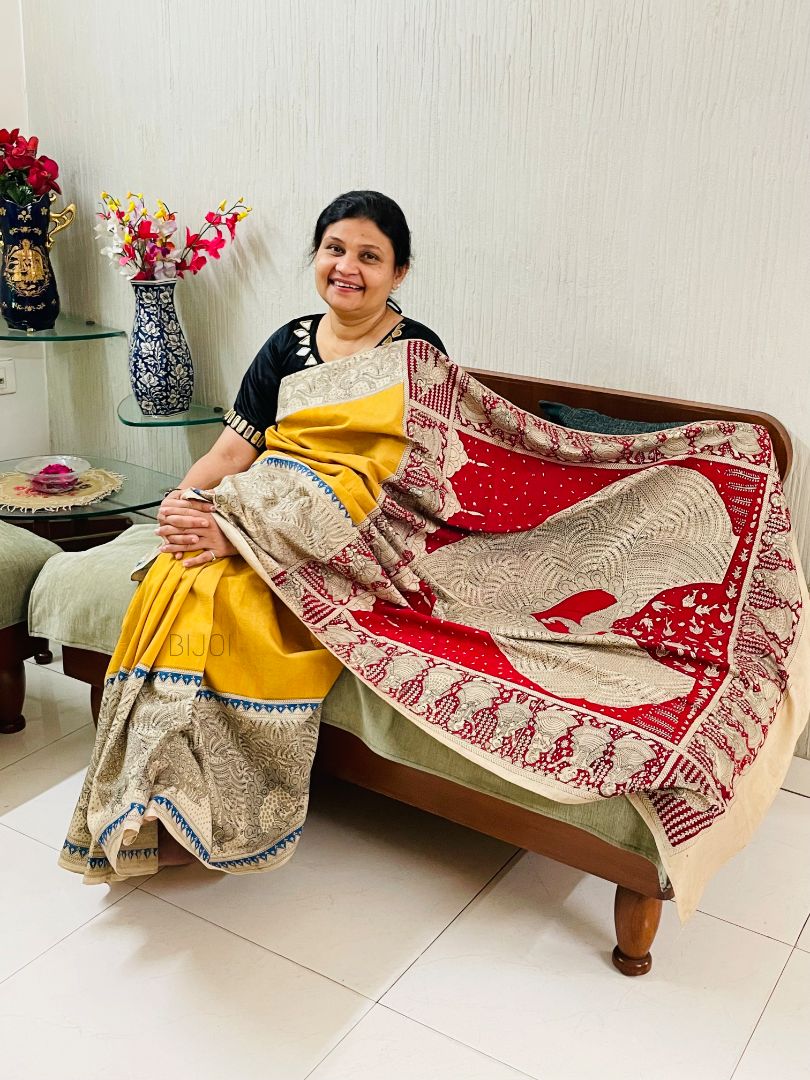 Golden beige handpainted Mata Ni Pachedi saree featuring traditional sacred motifs and intricate artisan detailing