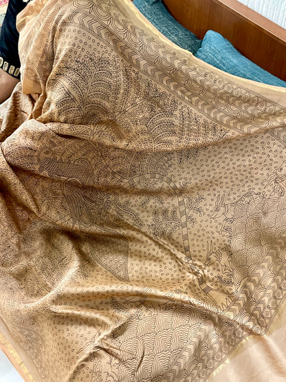 Traditional ancient gold Mata Ni Pachedi saree with vibrant handpainted motifs and graceful artisanal craftsmanship