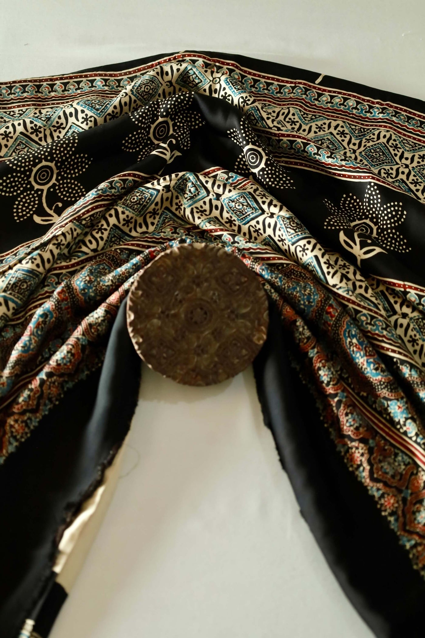Traditional black sunflower Ajrakh modal silk saree with rich artisanal prints and a soft flowing texture