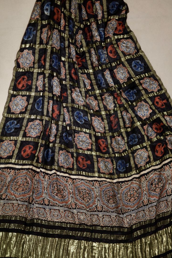 Handcrafted charcoal black Ajrakh dupatta made from premium modal silk with traditional Lagdi Patta detailing