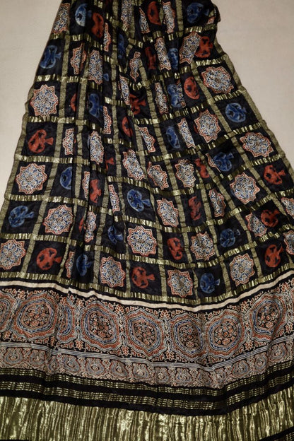 Handcrafted charcoal black Ajrakh dupatta made from premium modal silk with traditional Lagdi Patta detailing