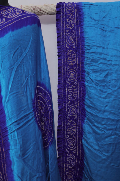 Premium cobalt Bandhani Gajji silk saree highlighting fine artisan craftsmanship and festive elegance