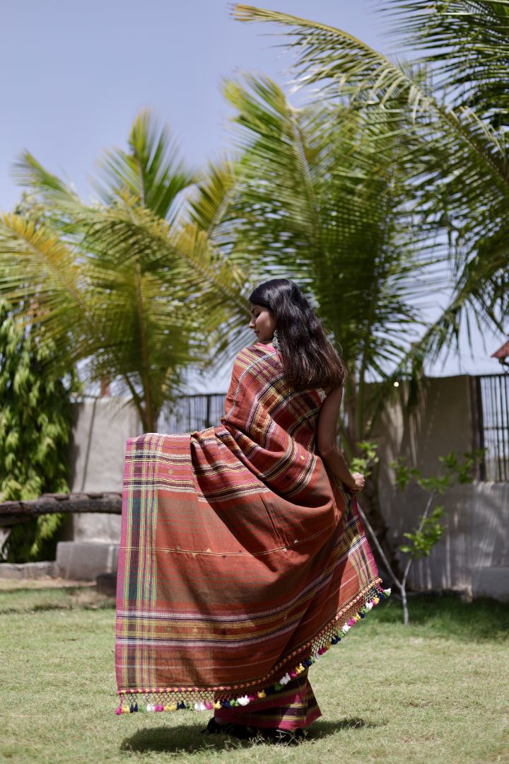 Traditional copper Bhujodi Kala Cotton saree with rich handwoven textures and graceful drape