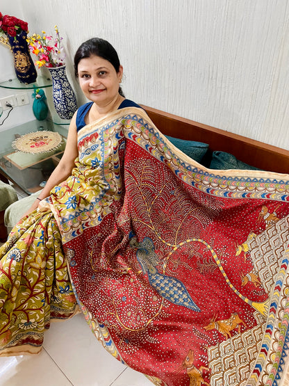 Traditional crimson Mata Ni Pachedi saree with vibrant handpainted motifs and graceful artisanal craftsmanship
