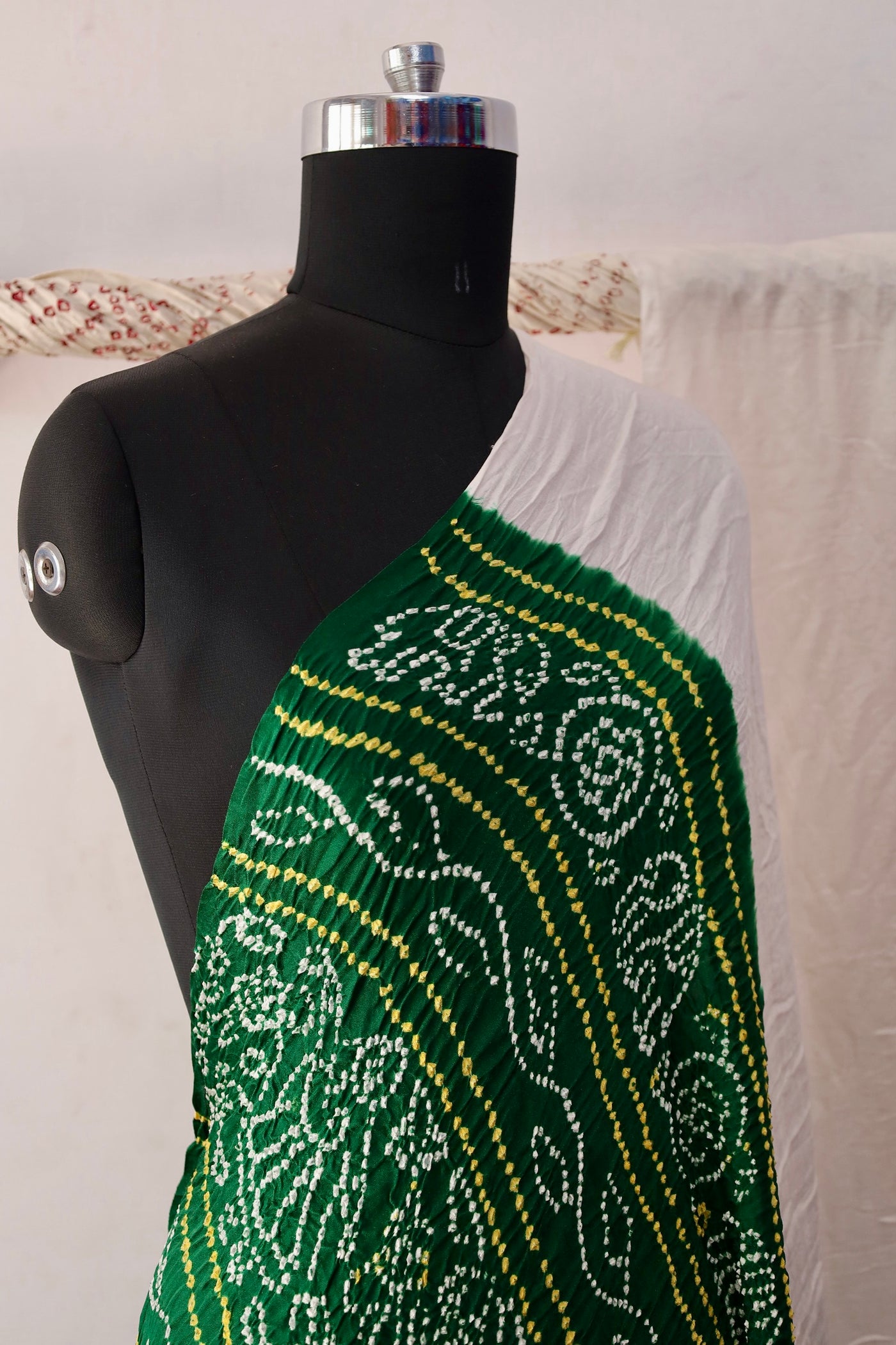 Emerald Bandhani Gajji silk saree featuring intricate tie-dye patterns and an elegant zari pallu