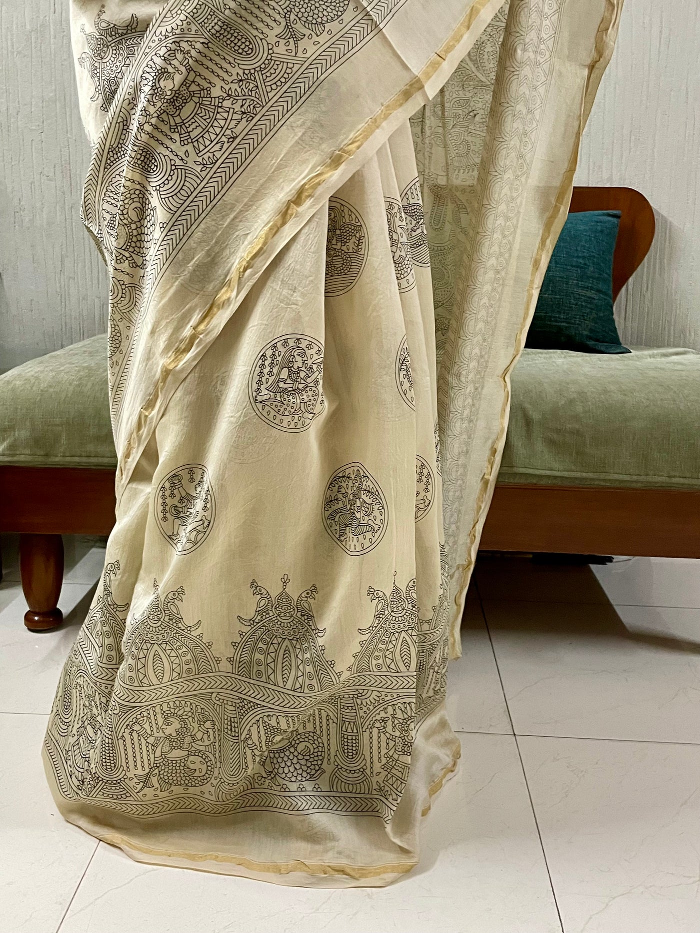 Traditional ivory white Mata Ni Pachedi saree with vibrant handpainted motifs and graceful artisanal craftsmanship