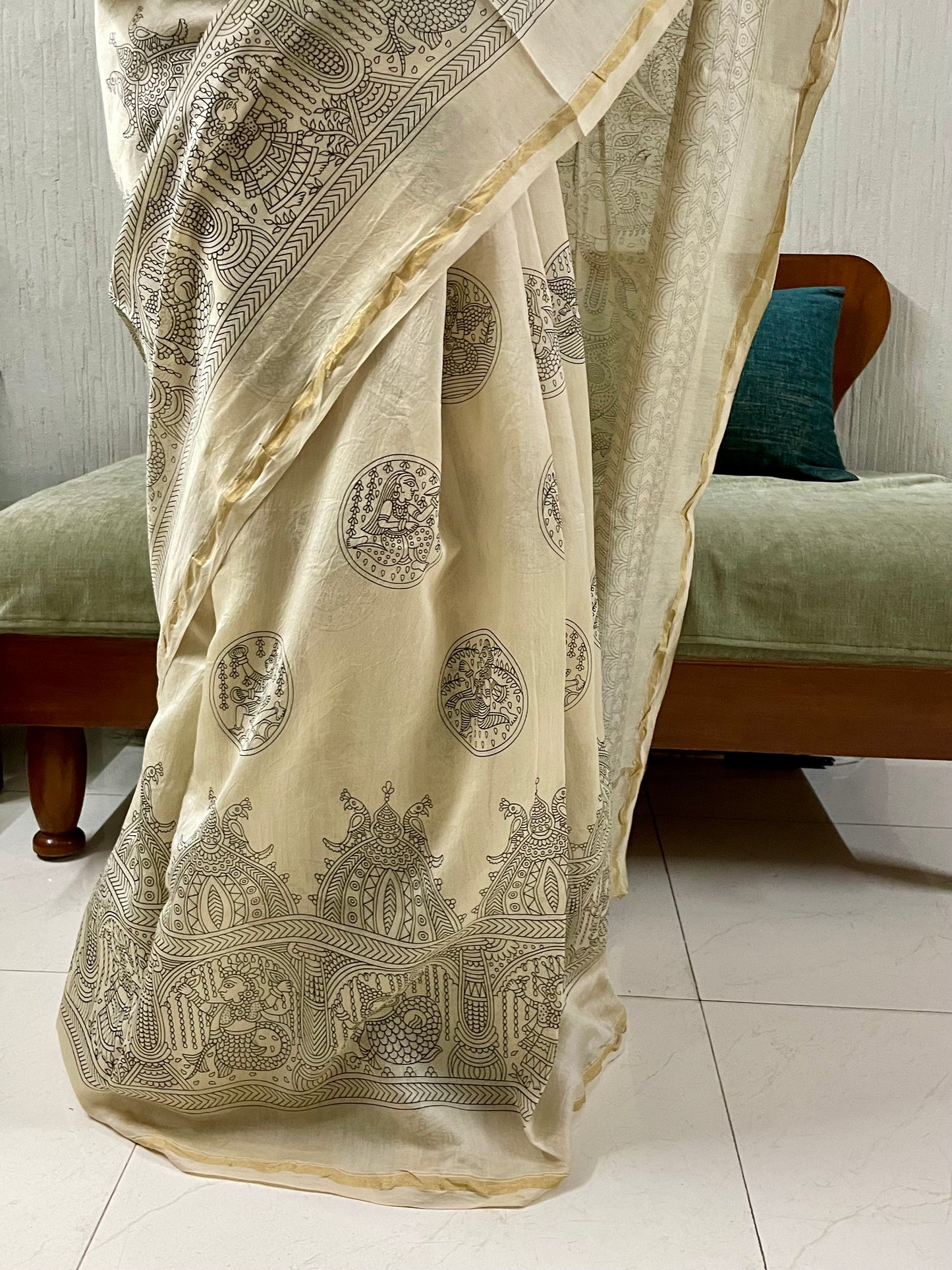 Traditional ivory white Mata Ni Pachedi saree with vibrant handpainted motifs and graceful artisanal craftsmanship