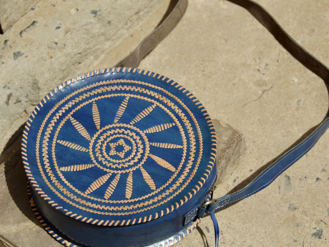 Leather bag featuring intricate handcrafted thread work on premium leather