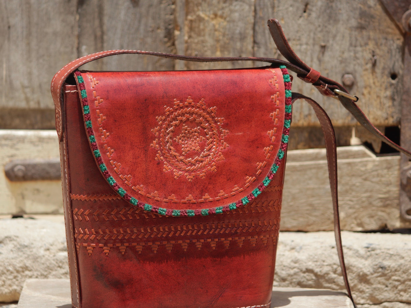 Handcrafted leather bag showcasing decorative thread work and heritage craftsmanship