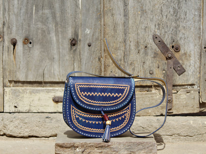 Handcrafted leather bag showcasing decorative thread work and durable craftsmanship