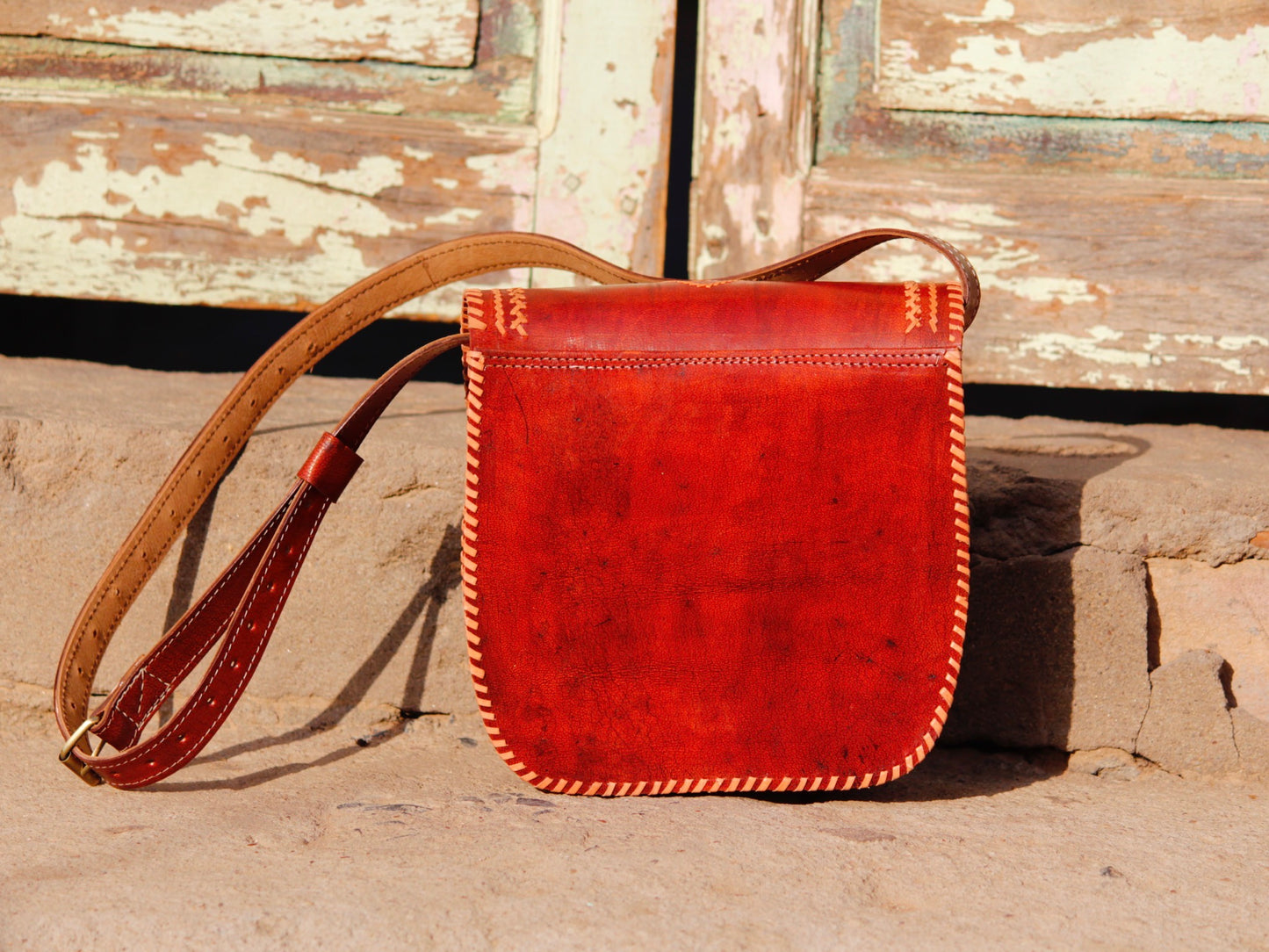 Elegant leather bag with embroidered accents and durable leather construction