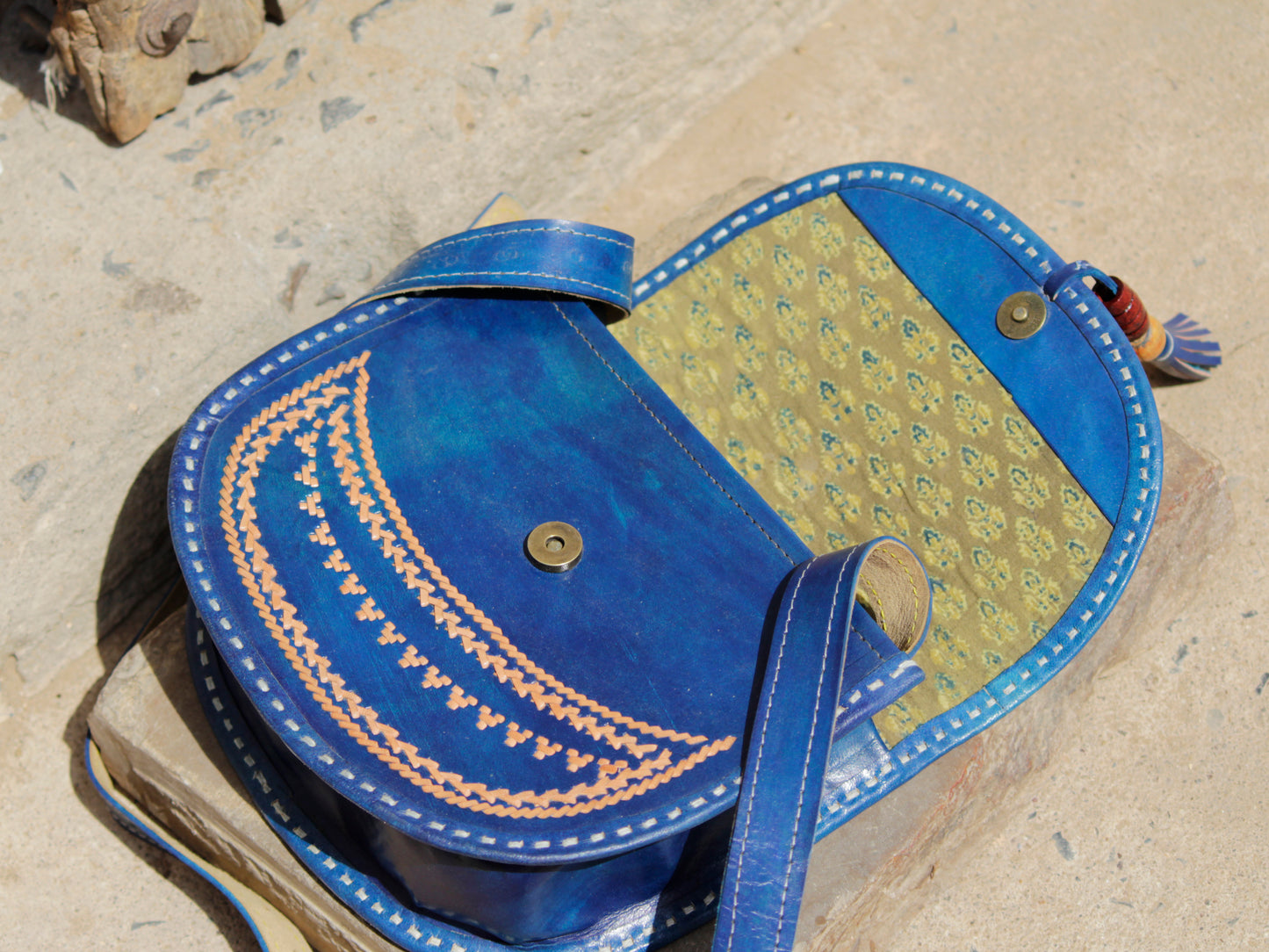 Elegant leather bag with heritage-inspired thread embroidery and unique design