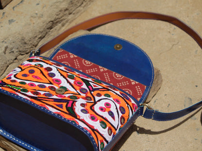 Artisan-made leather bag adorned with traditional Kutchi embroidered motifs and fine detailing