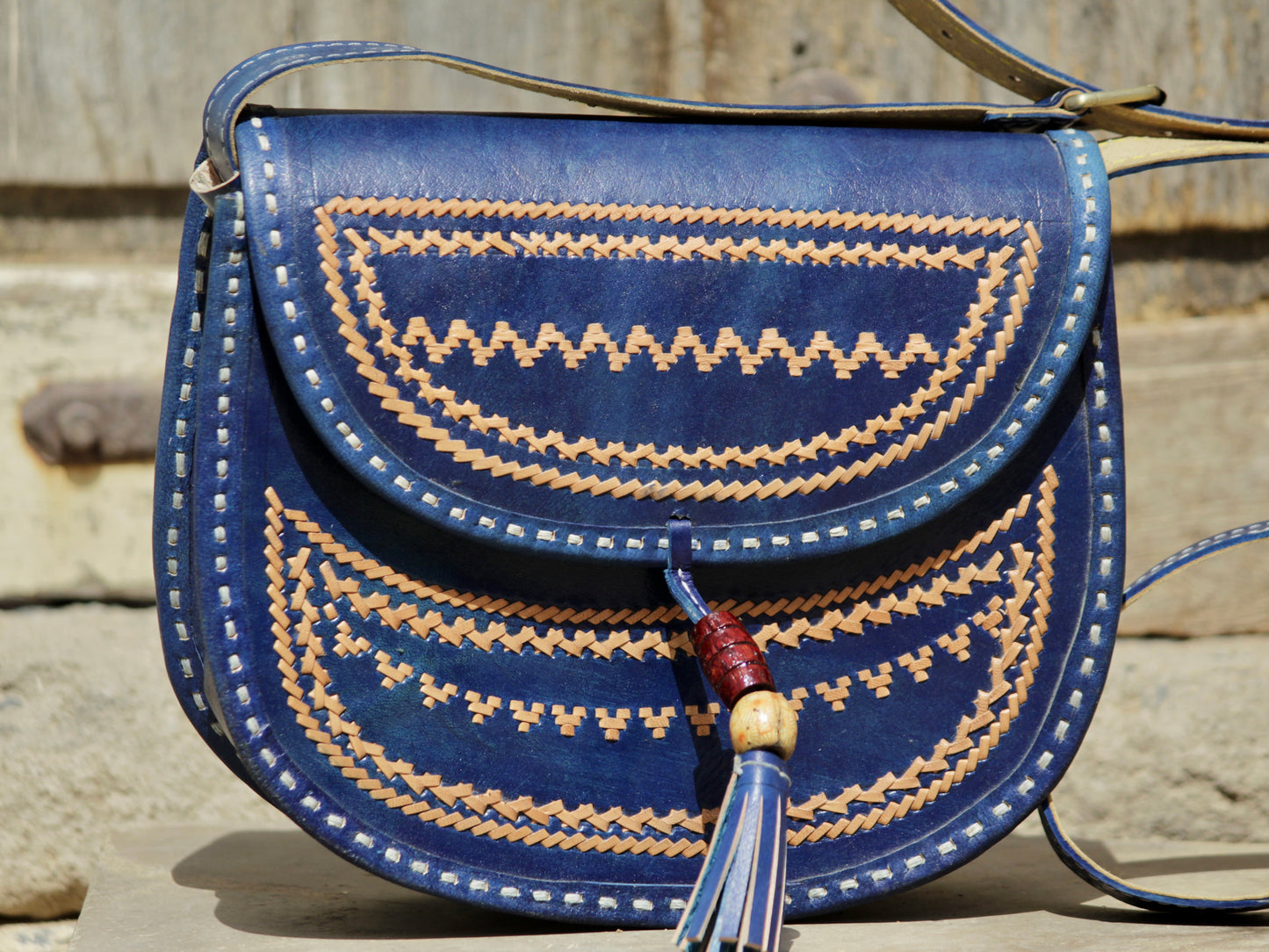 Handcrafted leather bag showcasing decorative thread work and durable craftsmanship