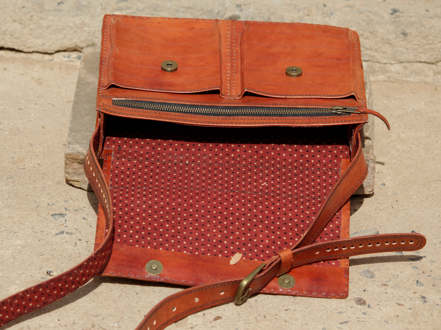 Handcrafted leather office bag showcasing decorative thread work and durable construction