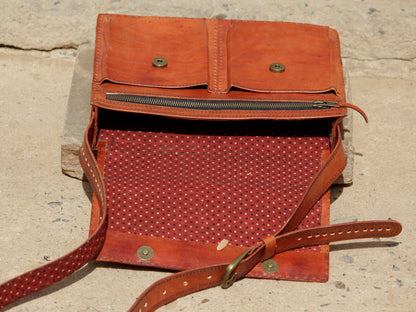 Handcrafted leather office bag showcasing decorative thread work and durable construction