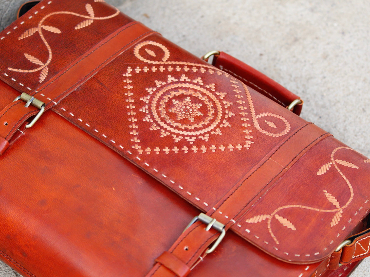 Handcrafted leather office bag showcasing decorative thread work and durable construction