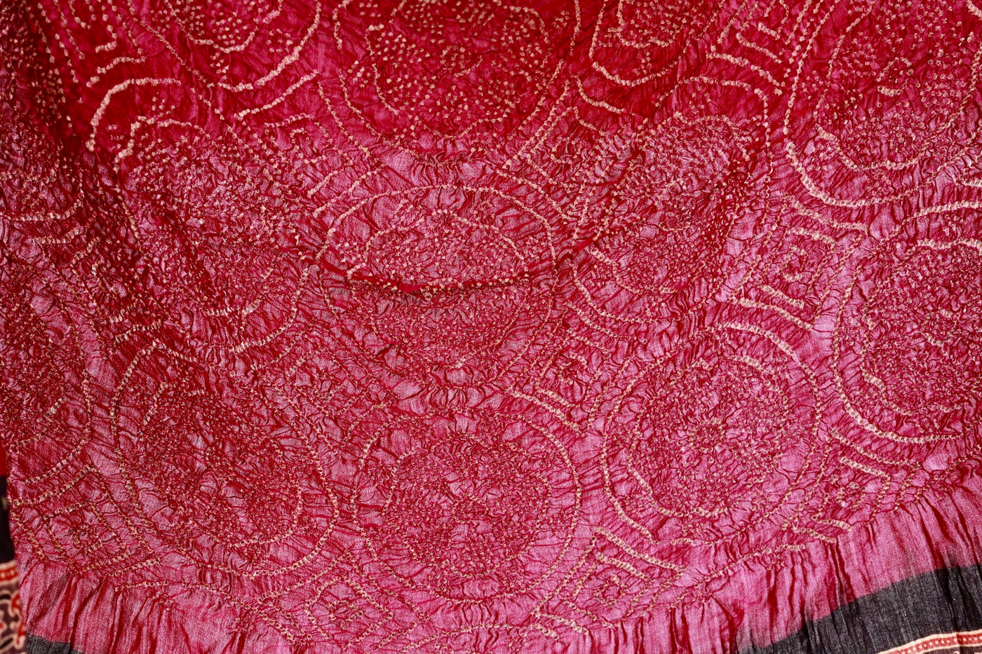 Traditional Ajrakh Bandhani silk saree in maroon hues with rich cultural and artisanal detailing