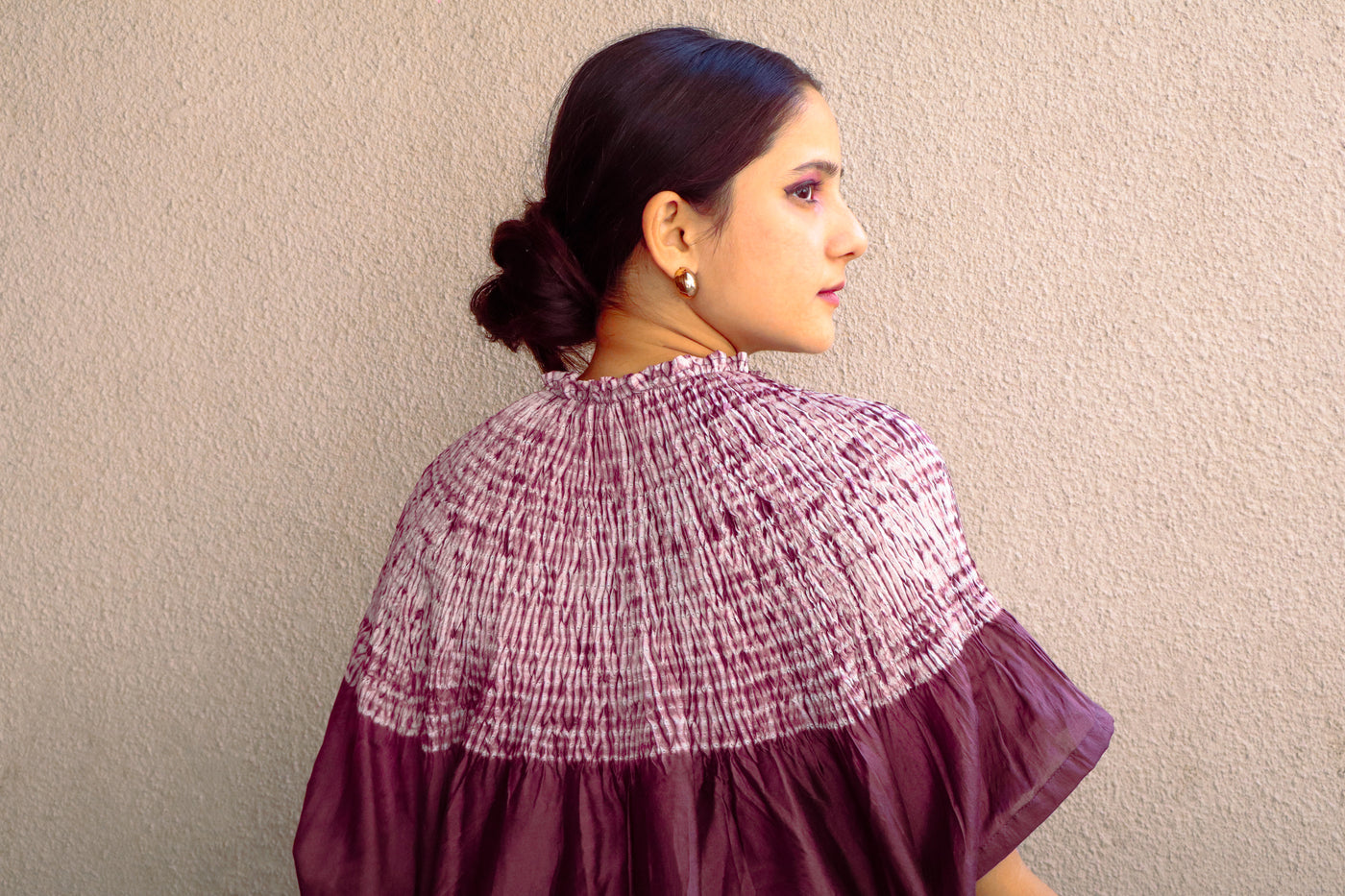 Traditional Bandhani Shibori silk kaftan highlighting rich craftsmanship and contemporary elegance