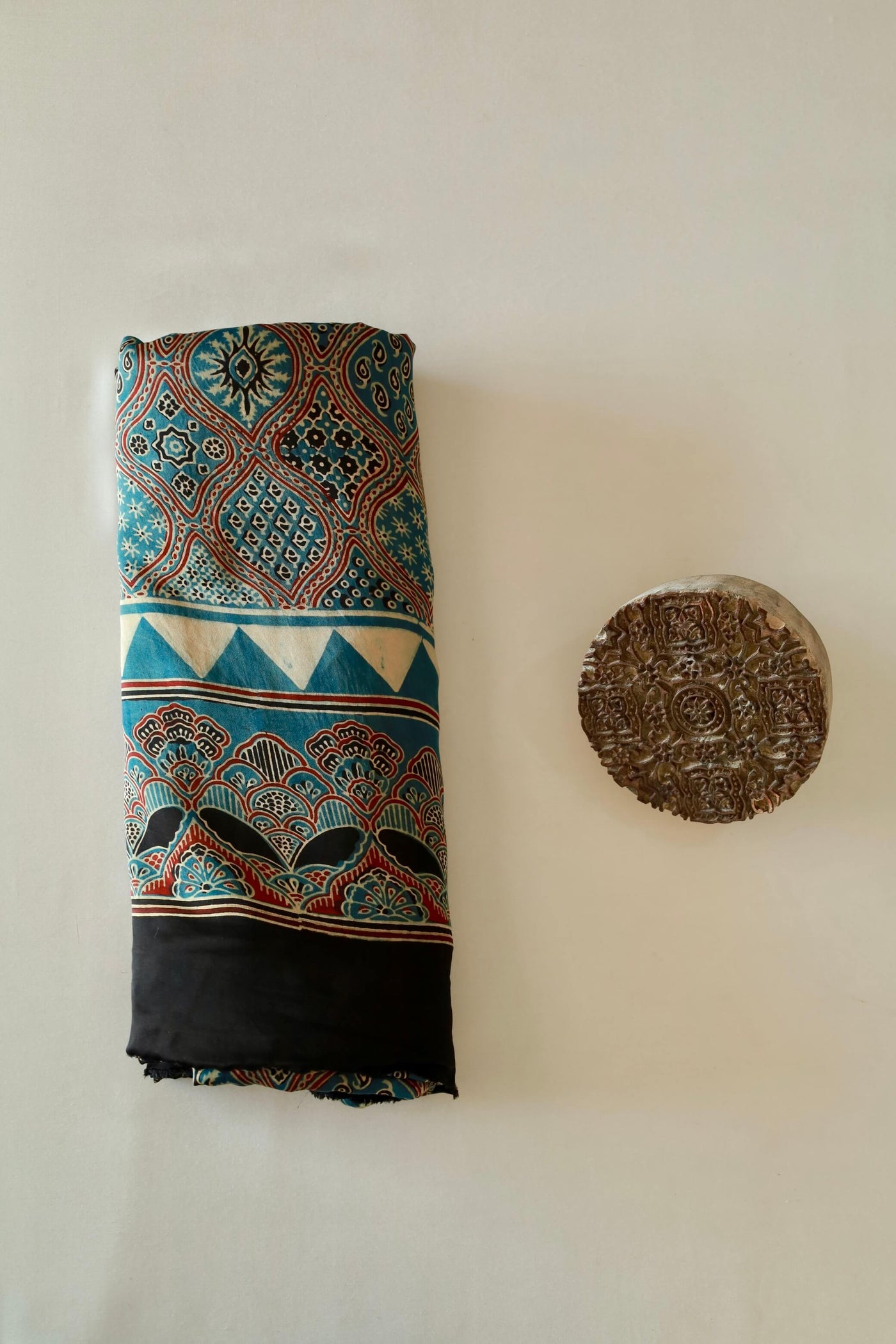 Traditional ocean blue Ajrakh modal silk saree with rich artisanal prints and a soft flowing texture