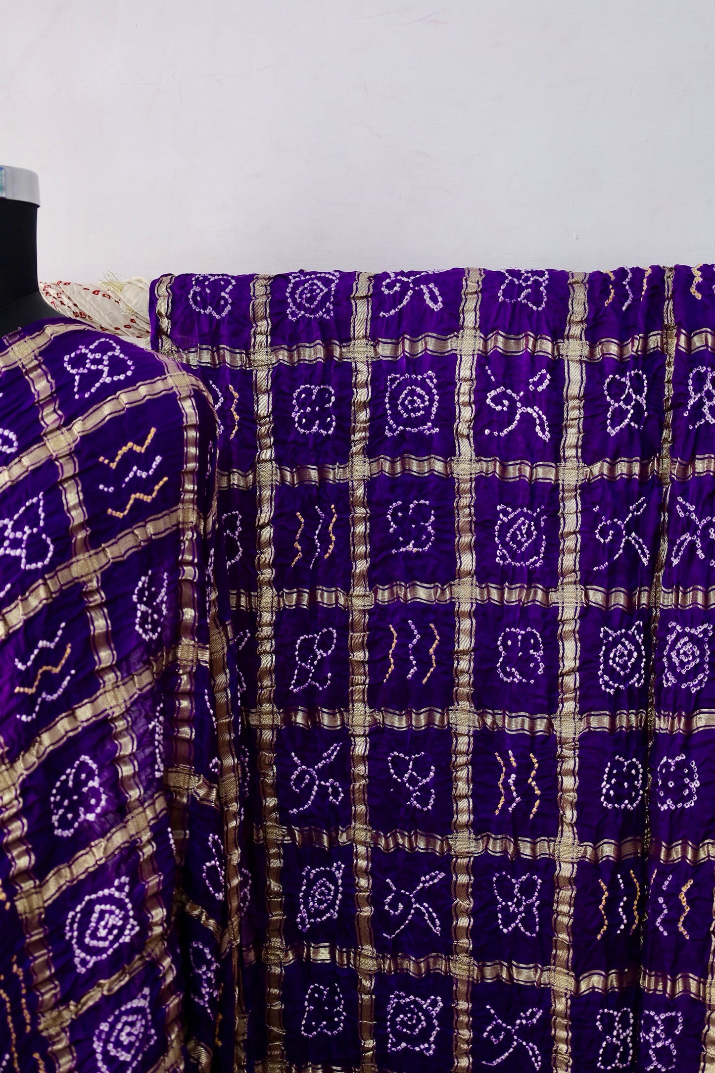 Elegant Gajji silk saree adorned with handcrafted Bandhani patterns and classic Gharchola design