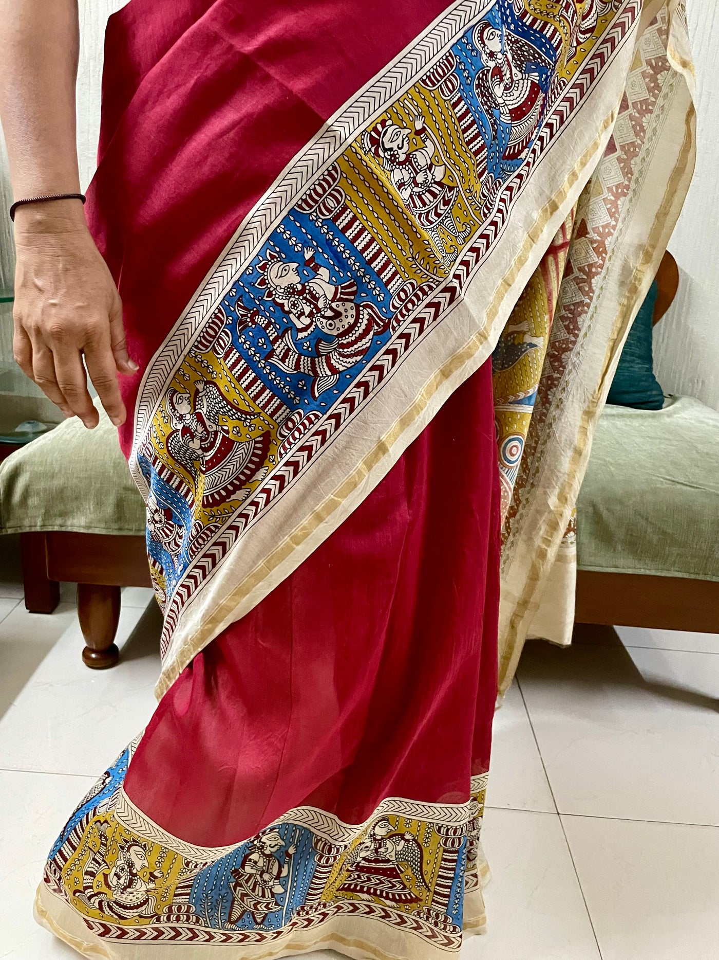 Traditional sunburst Mata Ni Pachedi saree with vibrant handpainted motifs and graceful artisanal craftsmanship