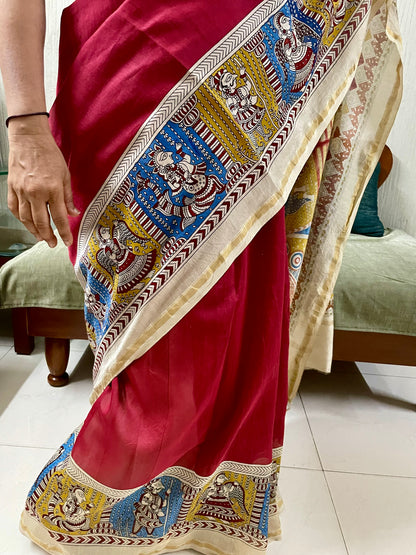 Traditional sunburst Mata Ni Pachedi saree with vibrant handpainted motifs and graceful artisanal craftsmanship