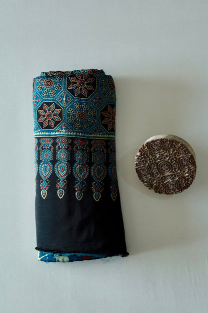 Premium turquoise blue modal silk saree showcasing authentic Ajrakh craftsmanship and timeless motifs