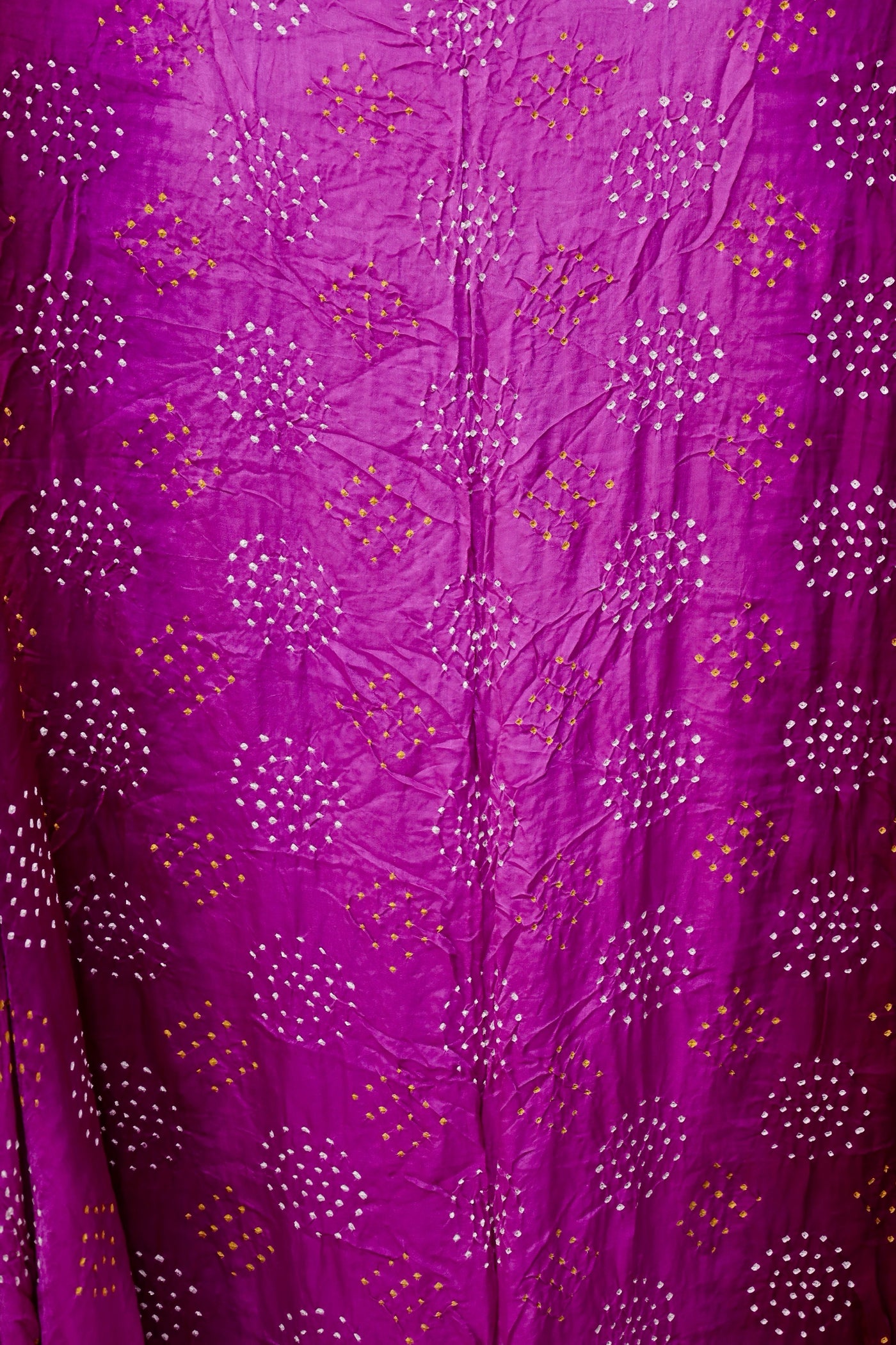 Handcrafted wine Gajji silk saree showcasing authentic Bandhani artistry with rich zari detailing