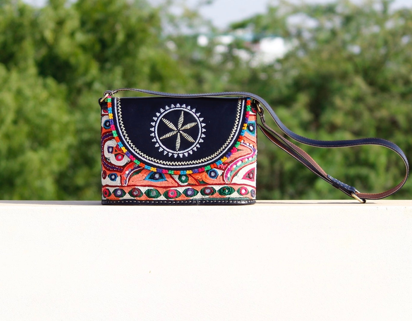 Leather bag adorned with authentic Kutchi hand embroidery on premium leather