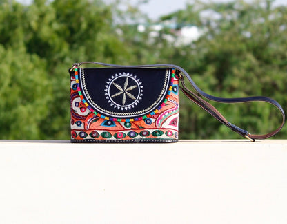 Leather bag adorned with authentic Kutchi hand embroidery on premium leather
