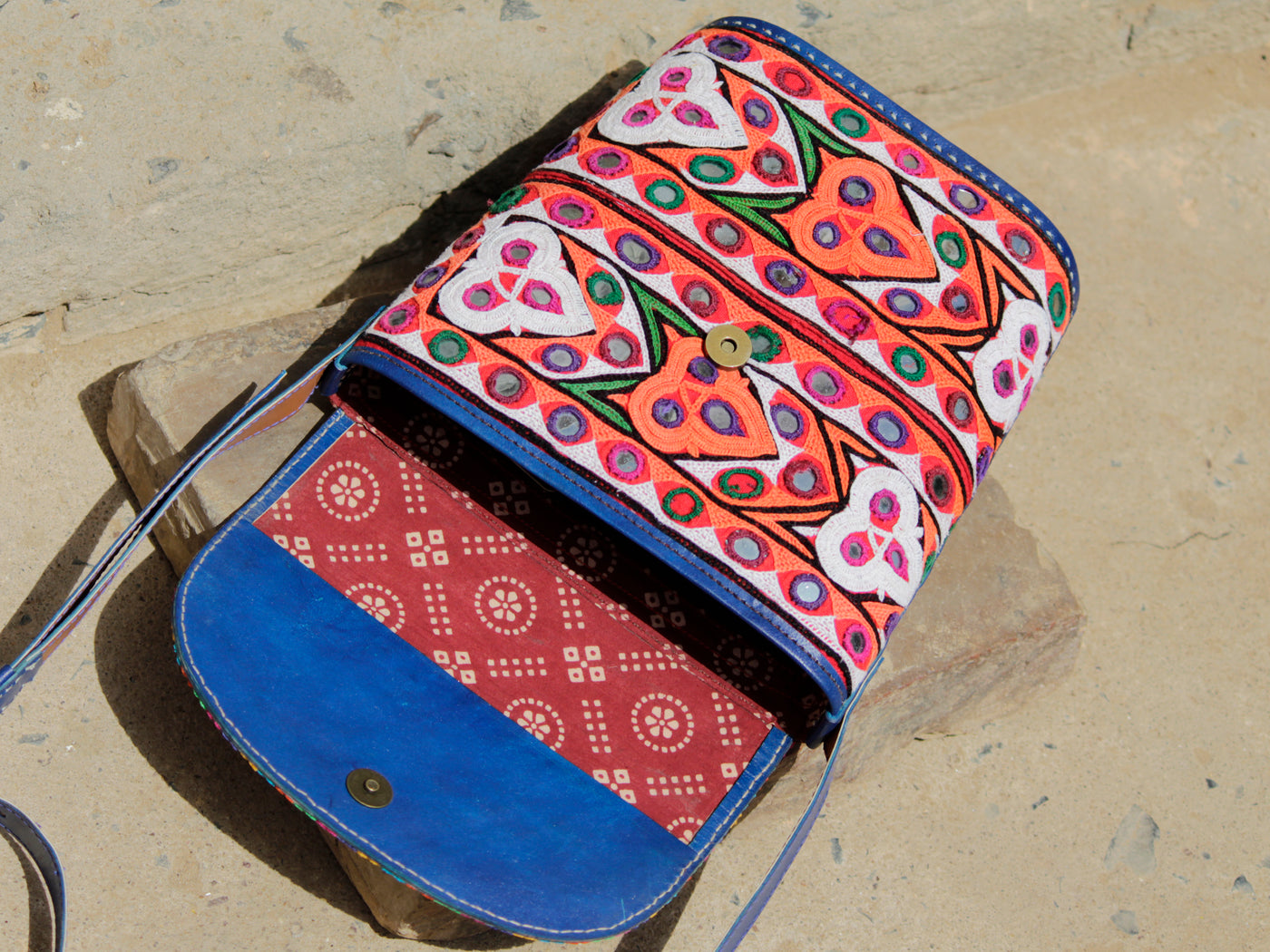 Leather bag featuring authentic Kutchi embroidery and intricate zari work on premium leather