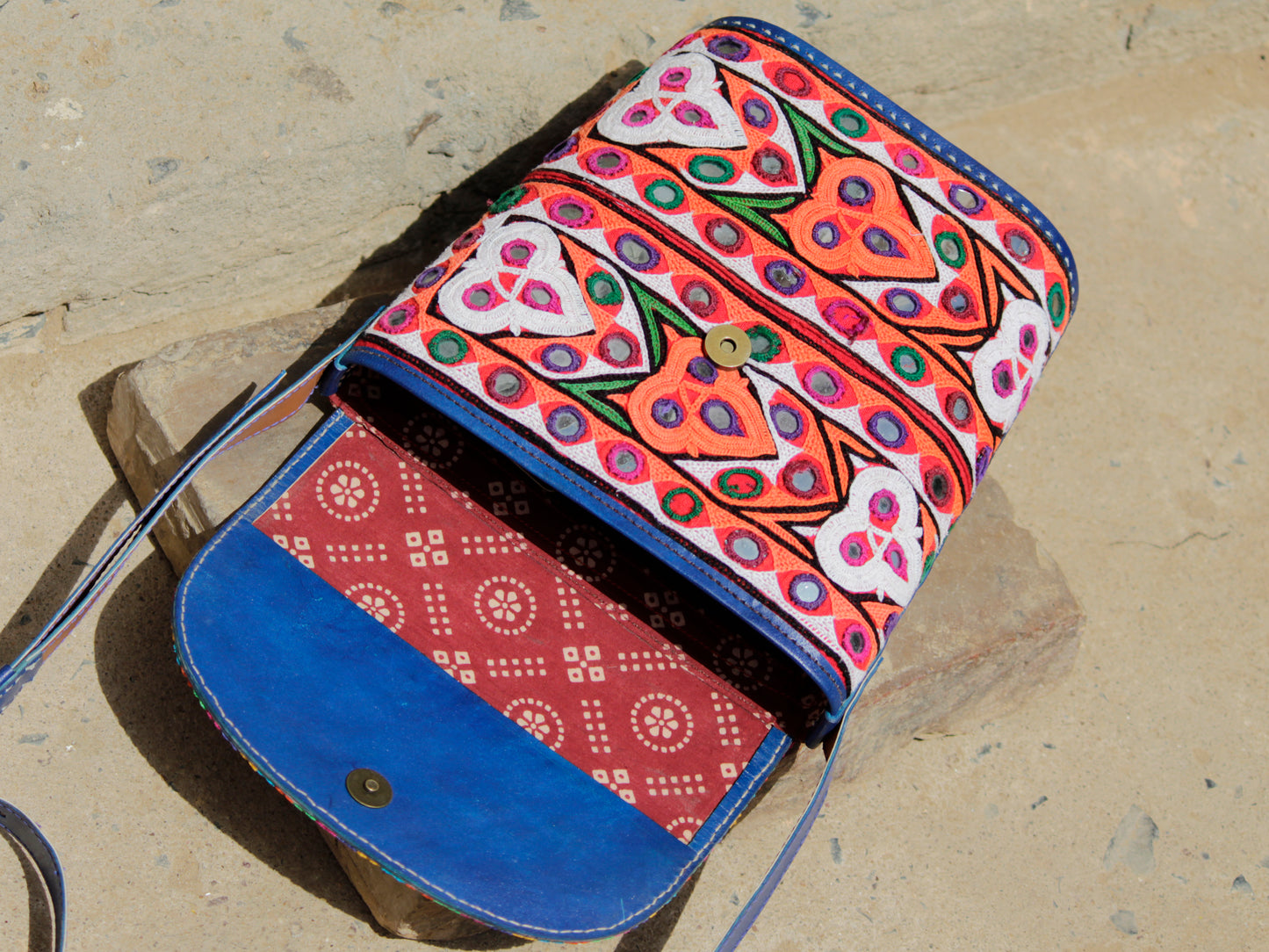 Leather bag featuring authentic Kutchi embroidery and intricate zari work on premium leather
