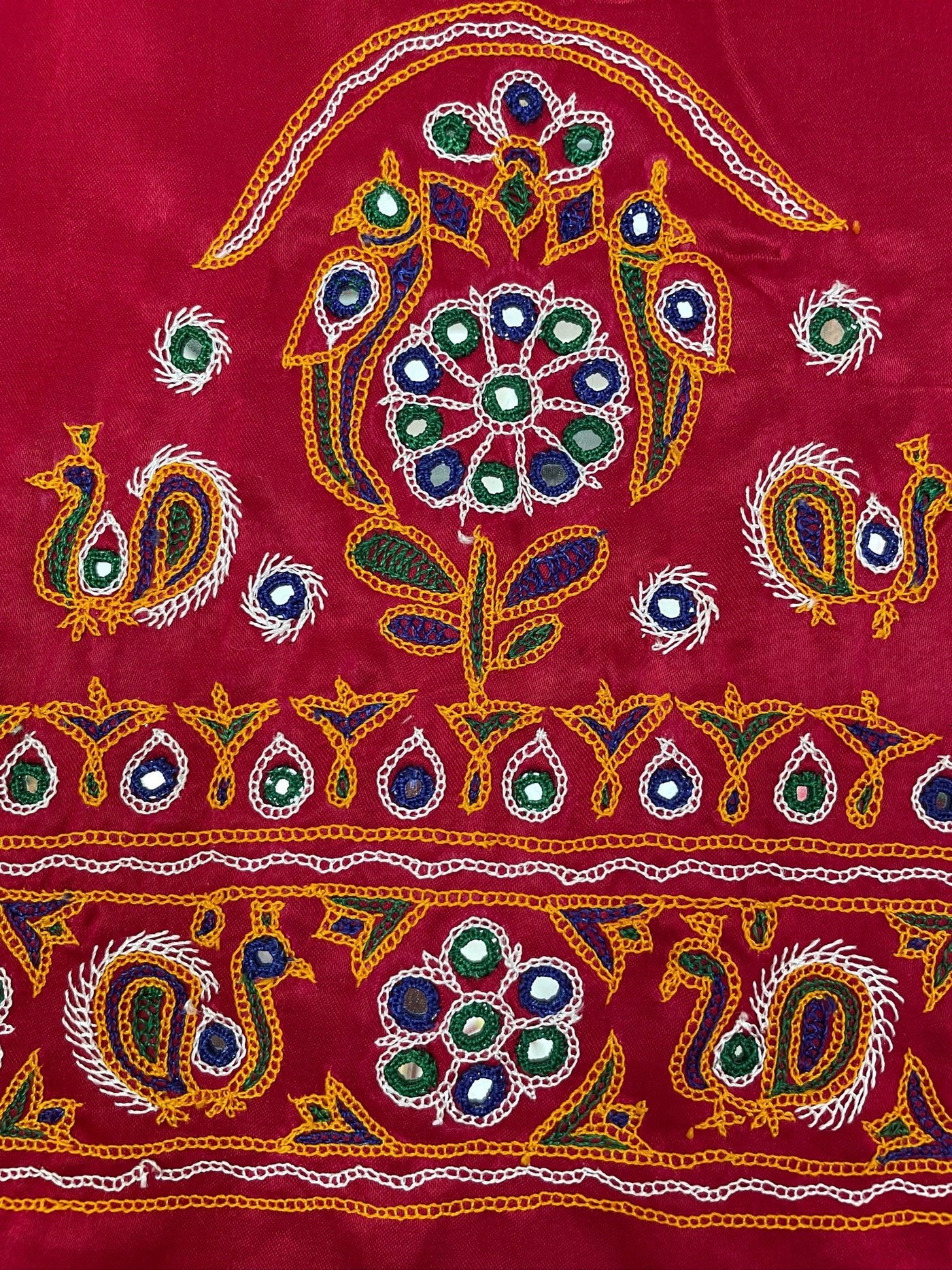 Elegant pink blouse piece adorned with beautiful Ahir embroidery motifs