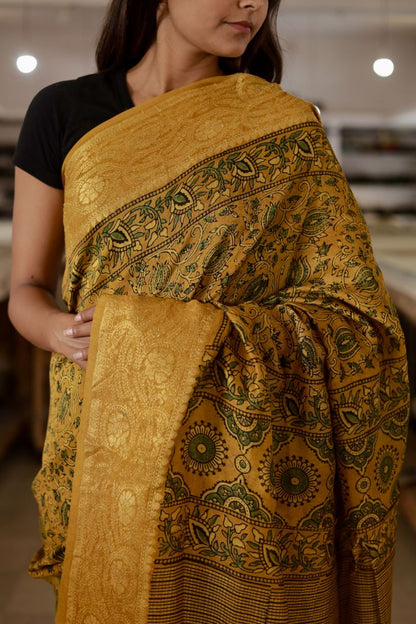 Handcrafted antique gold Chanderi silk saree adorned with authentic Ajrakh patterns and elegant zari detailing