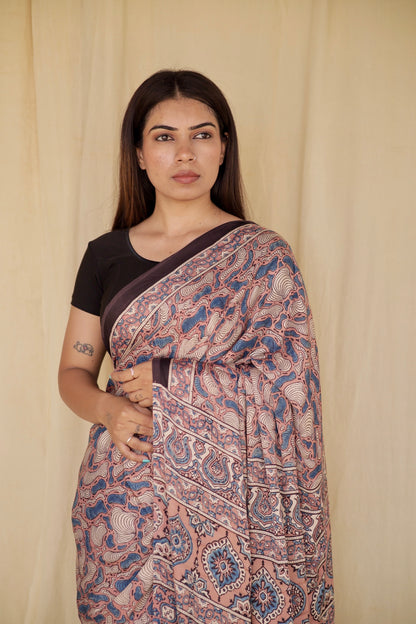 Handcrafted antique rose modal silk saree adorned with traditional Ajrakh patterns and elegant detailing